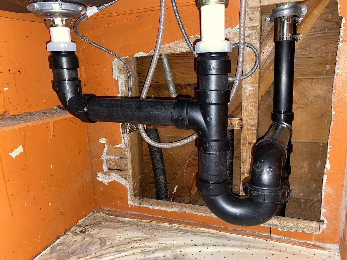 Professional Garbage Disposal Repair equipment and tools on the job in Brandon